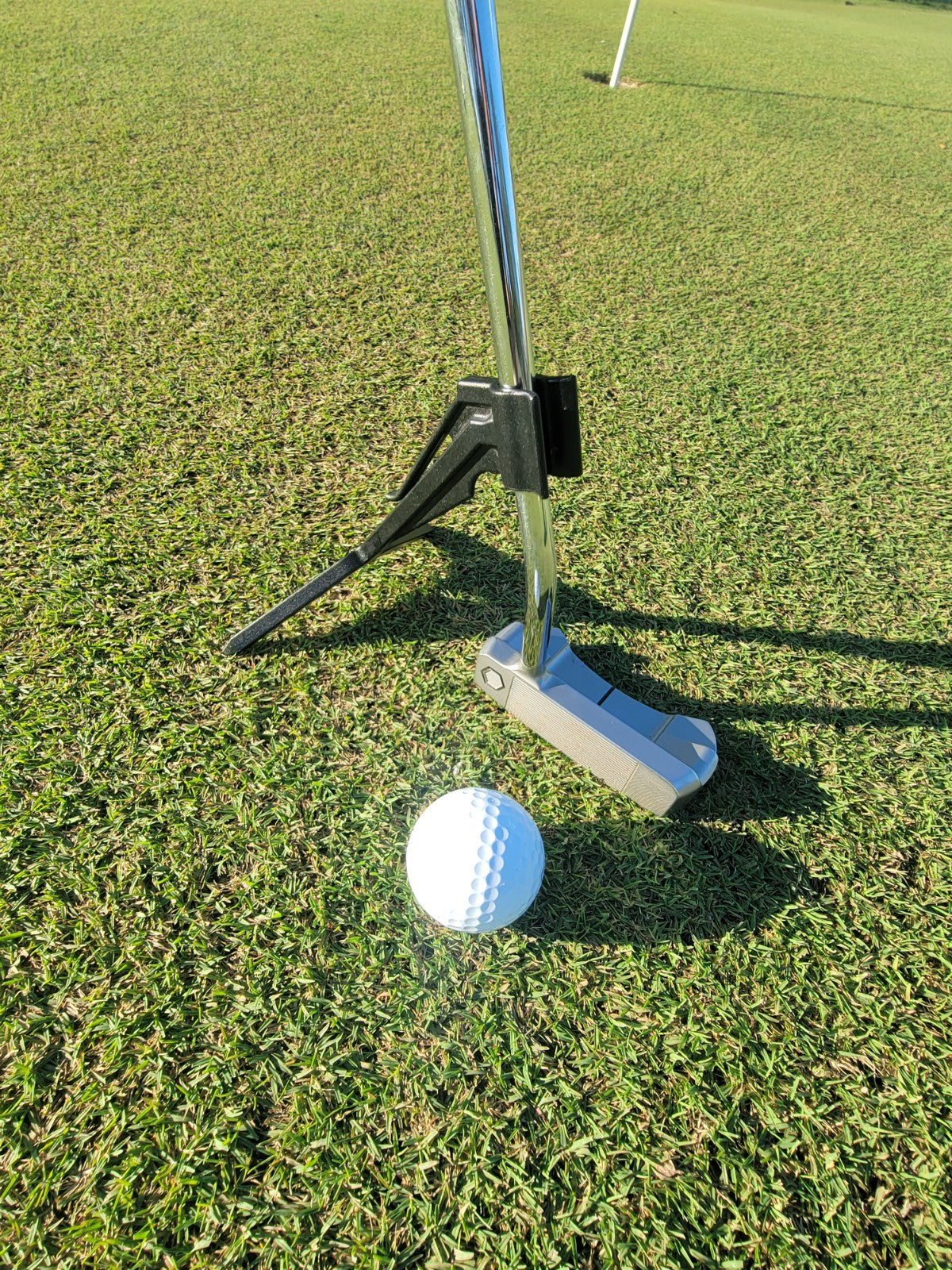 Photo of a T-Caddy golf club stand on the green