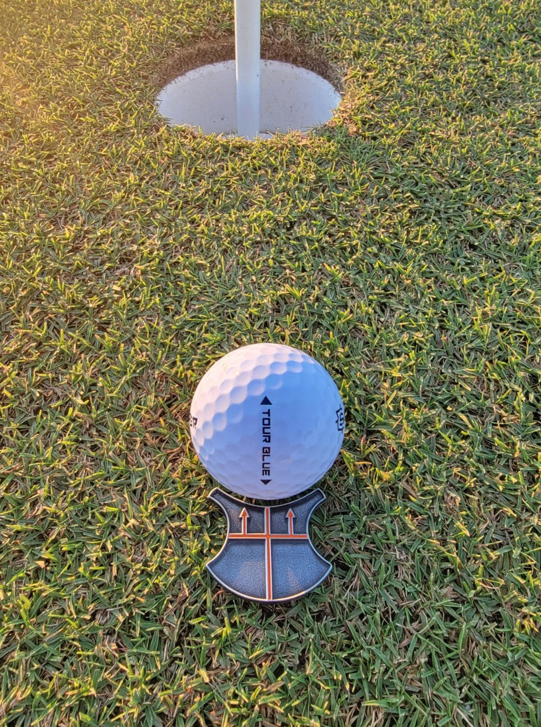 image of ball lined up with hole using t-putt