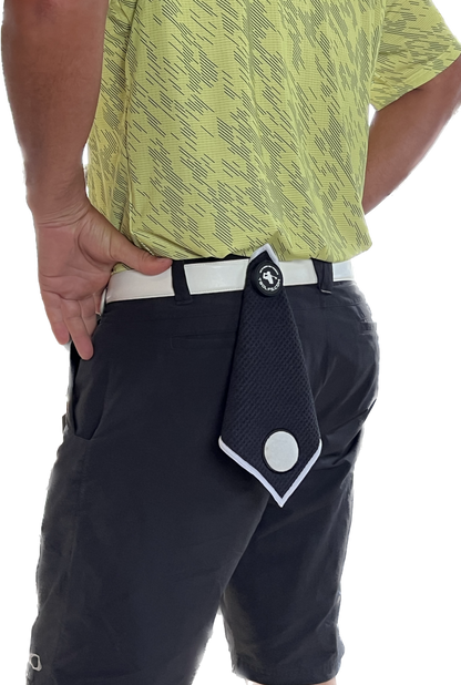 Golf towel hanging on a belt with a belt clip